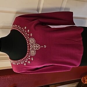 Deep pink beaded sweater.